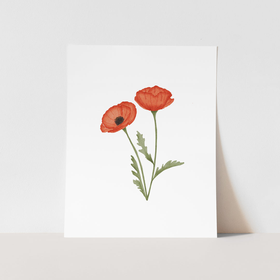 A white paper with a single red flower illustration on it.