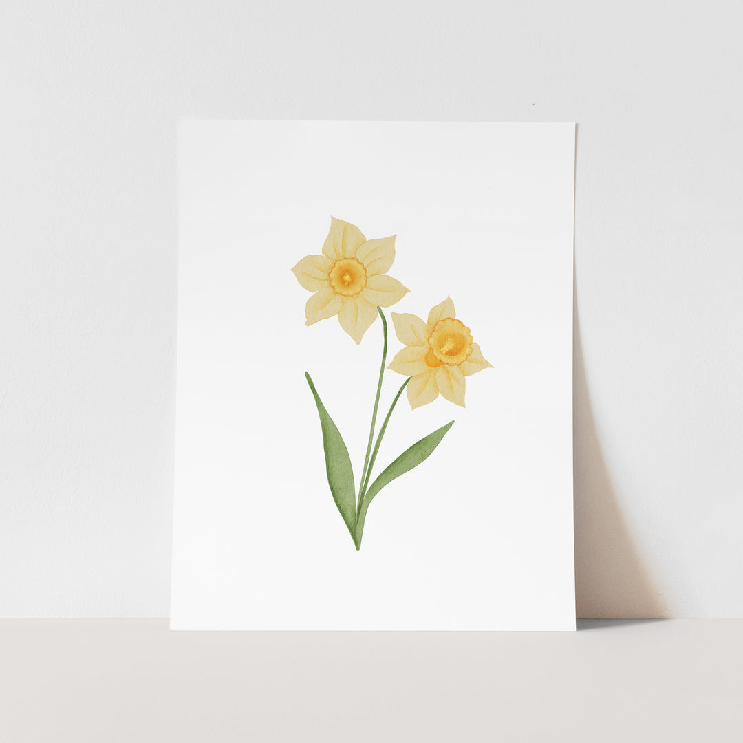 A white square card with a watercolor illustration of two yellow daffodils on it.