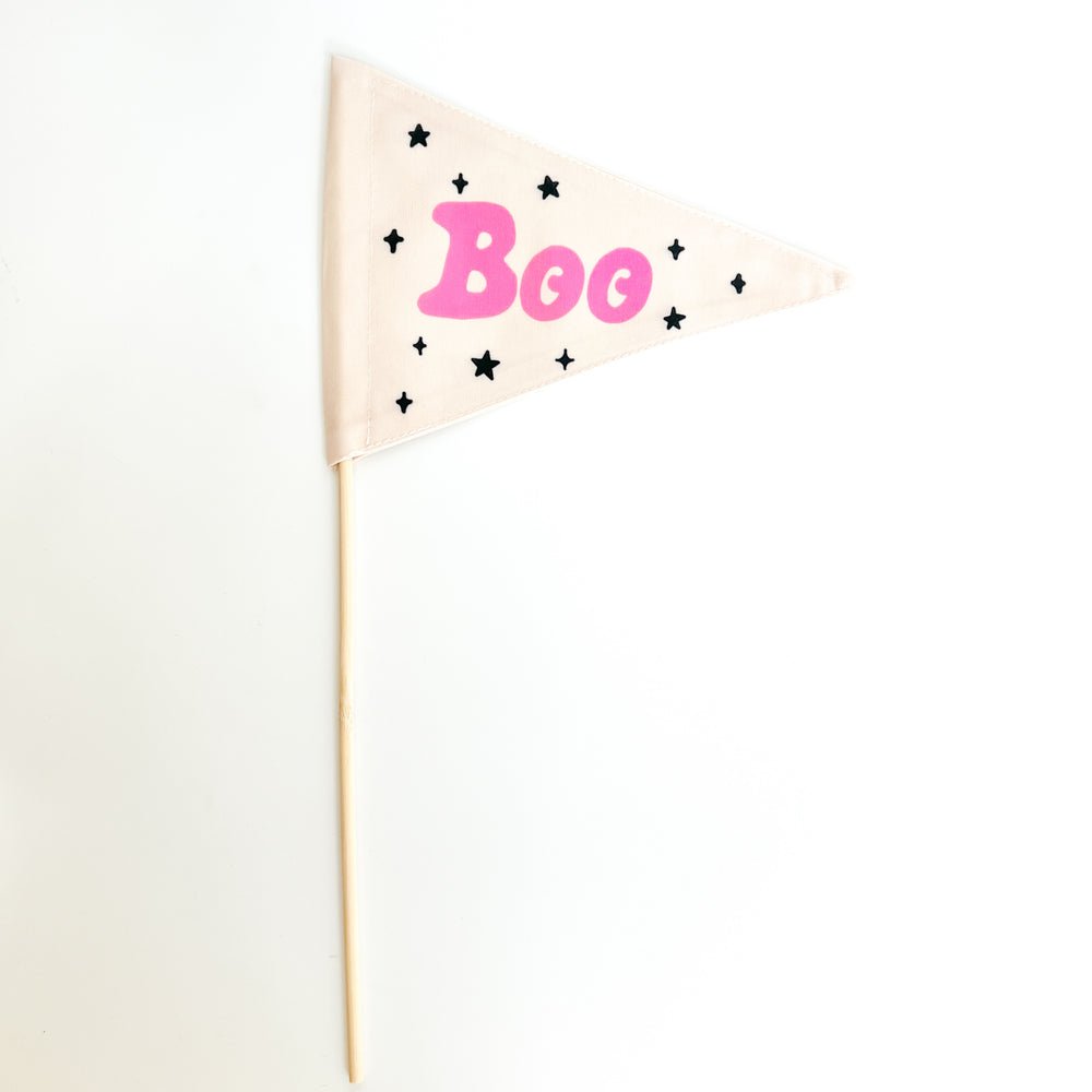 Triangle flag with 'Boo' in pink and black stars on a white background