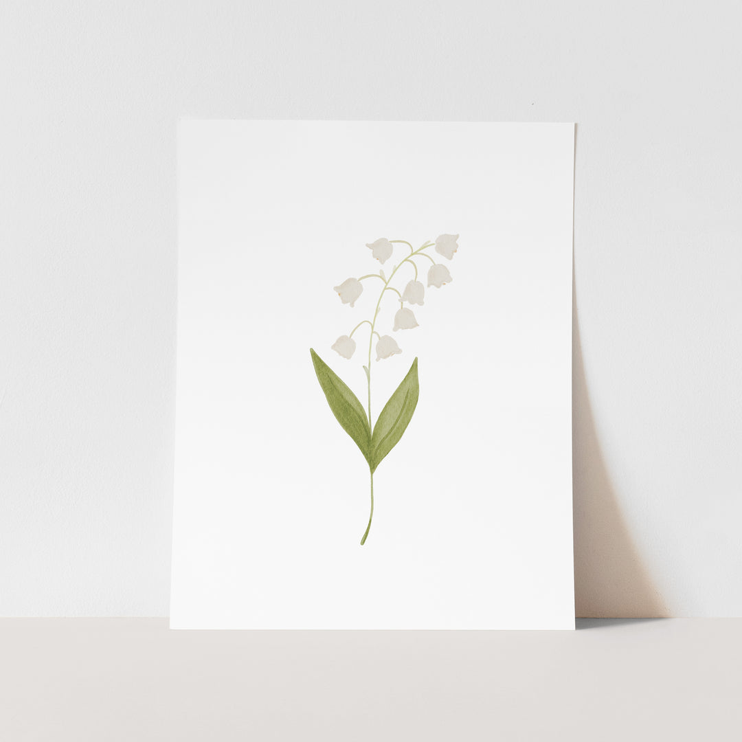 A white square card with a simple illustration of a lily of the valley flower on it.