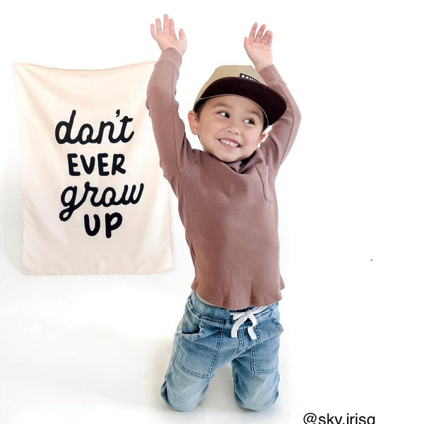{Black} Don't Ever Grow Up Banner
