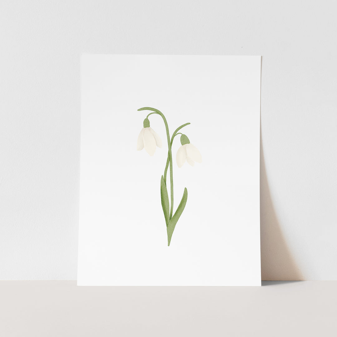 A white square card with a simple illustration of two white flowers with green stems.